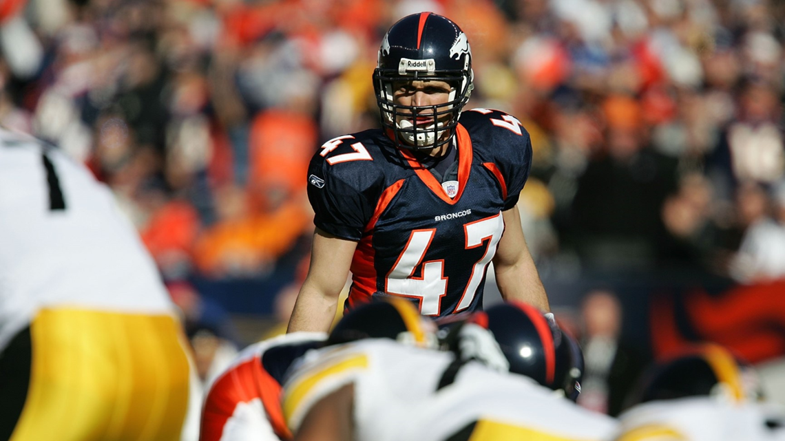 Karl Mecklenburg of the Denver Broncos runs on the field during a News  Photo - Getty Images