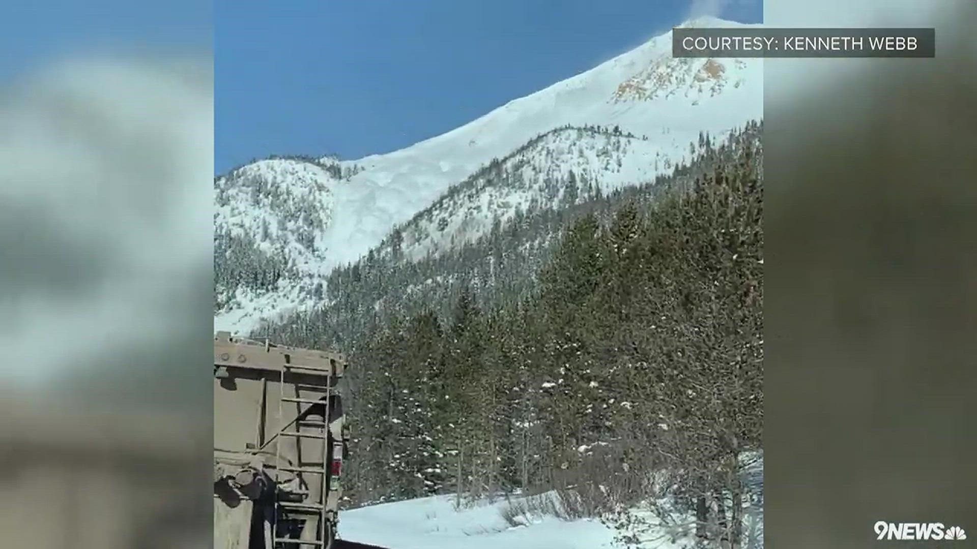 Crews doing mitigation work triggered the avalanche that covered eastbound lanes of I-70 with 8 feet of snow and westbound lanes with 15 feet. The highway will be closed for hours.