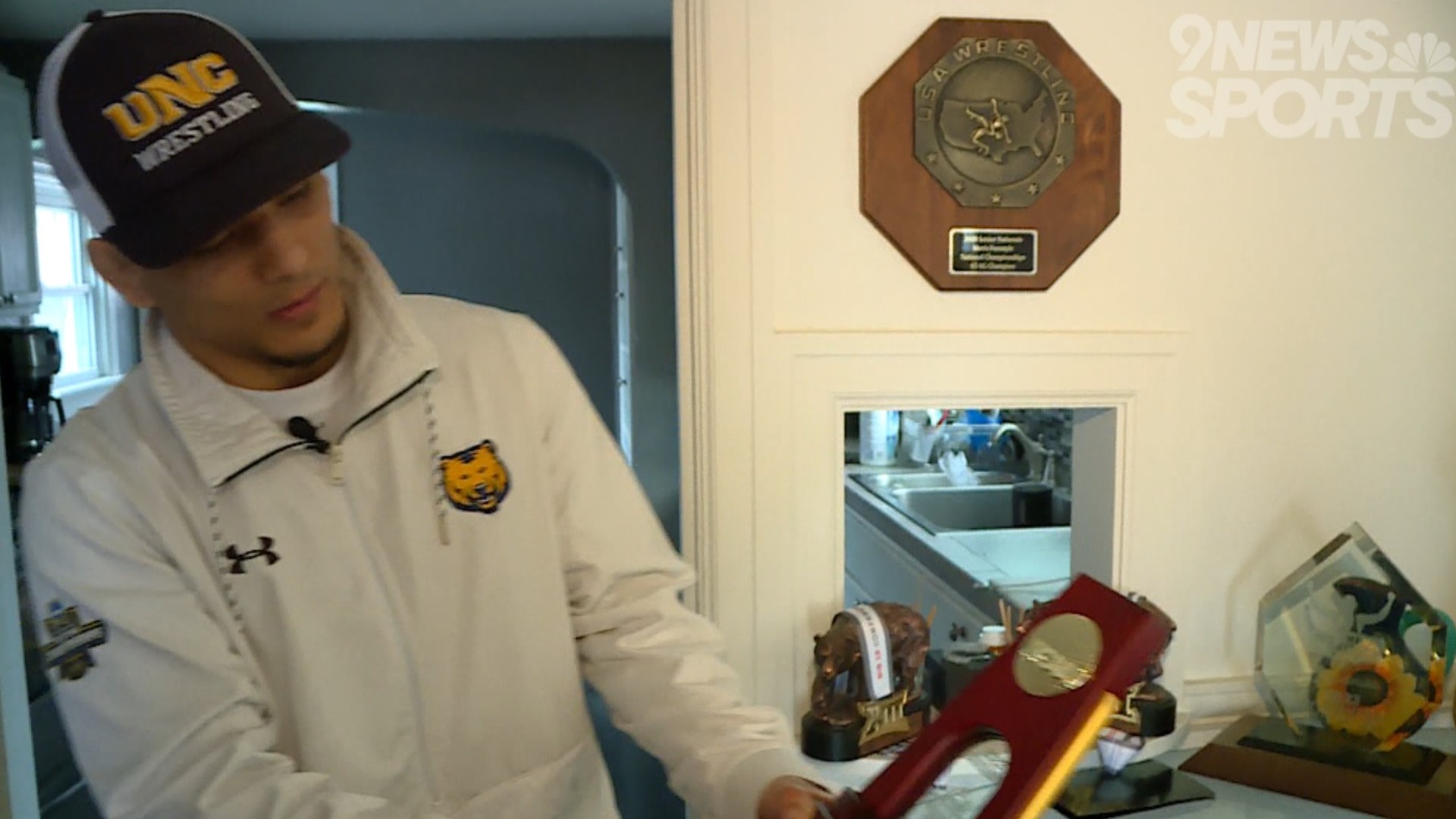 Northern Colorado's Andrew Alirez brought home his wrestling national championship trophy.