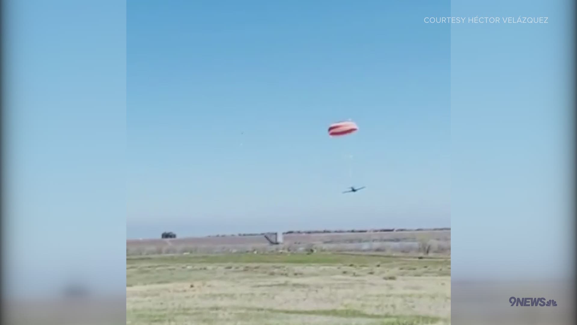 Video shows a Cirrus SR-22 making a landing with its parachute deployed following a mid-air collision with another plane near Cherry Creek Reservoir.