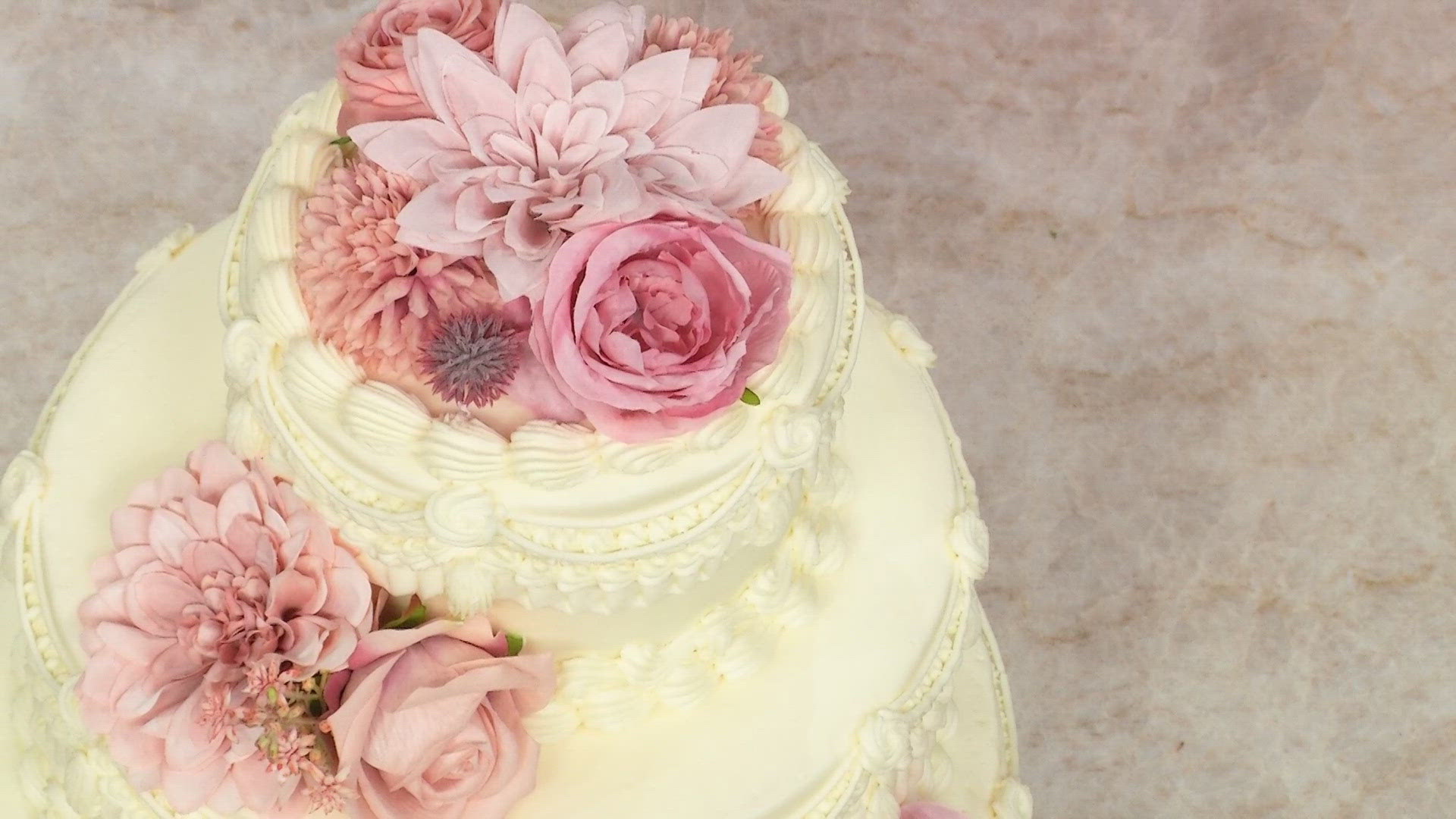 Angie Wells from The Cake Bar in Denver walked us through the cake flavors and decorations she's seeing brides request this summer.