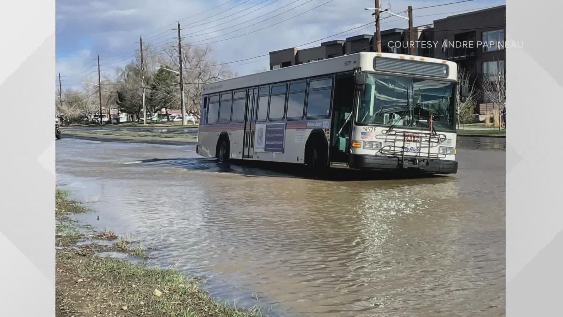 A water main opened up in Boulder and water is rushing down Arapahoe near 55th. The bus has a couple of tires sinking into that hole.