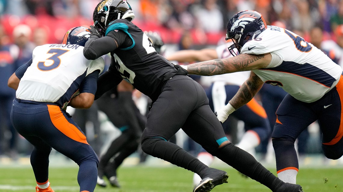 Denver Broncos orange-blue stripe uniform combo returns vs Titans