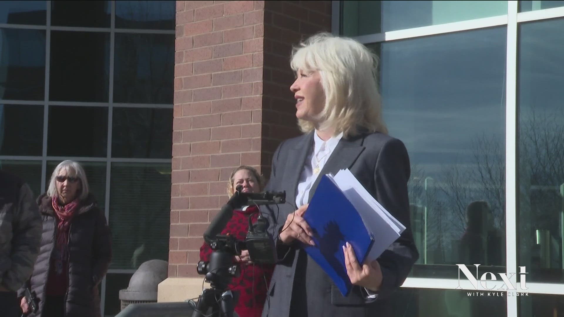 The former Mesa County clerk faces felony charges that include tampering with voting systems. She claims the criminal investigations are harassment.