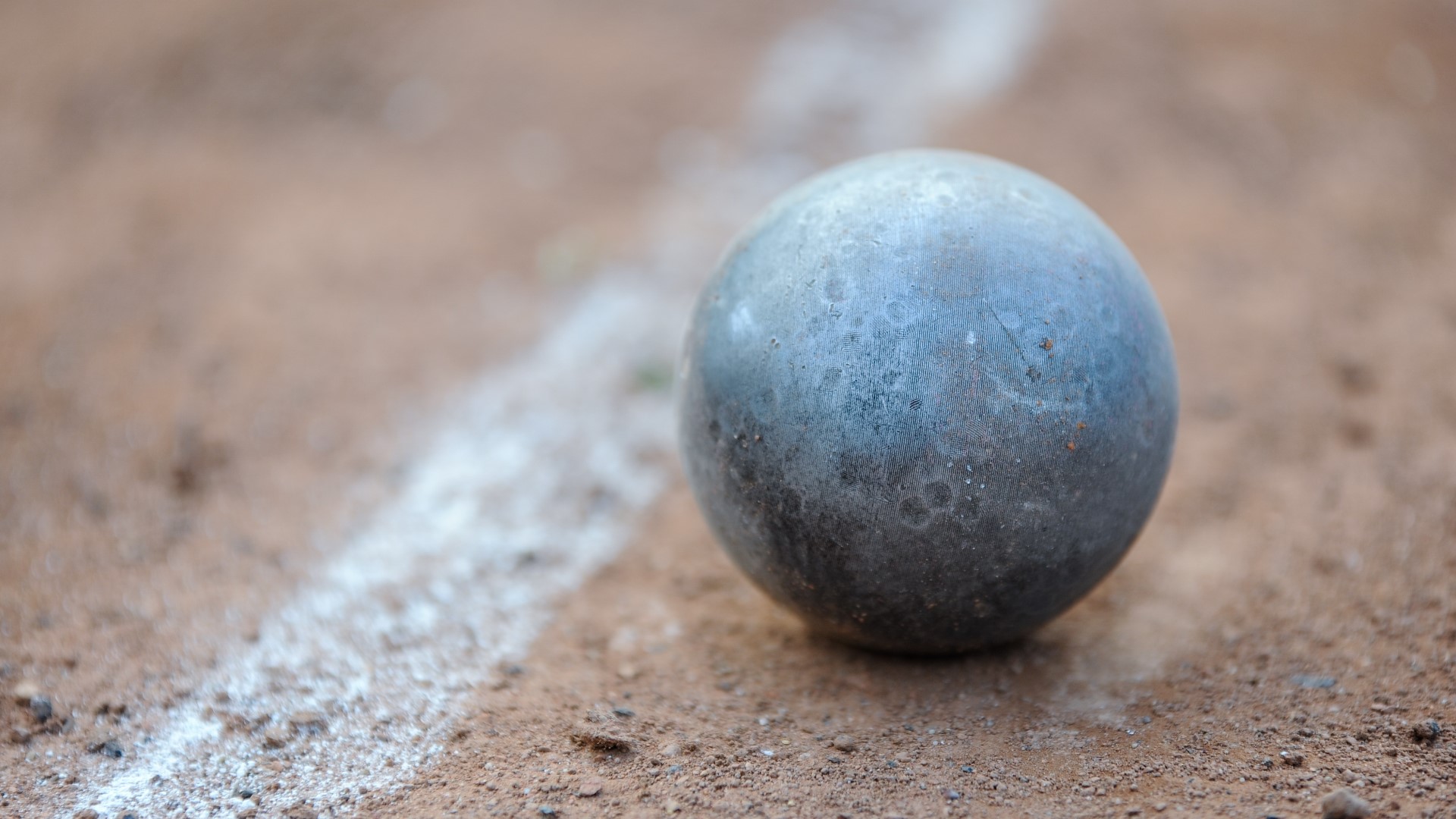How much does a shot put weigh at the Olympics?