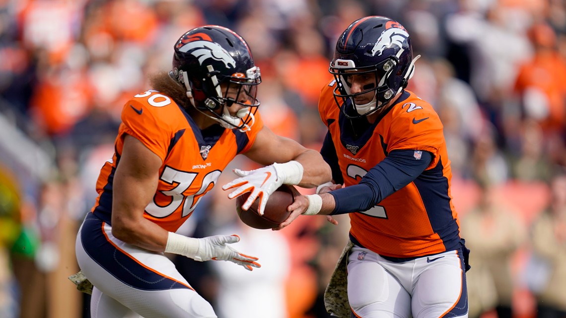 Denver Broncos running back Phillip Lindsay leaves the field after an NFL  football game against the New England Patriots while wearing a headband  with colors supporting Crucial Catch initiative, Sunday, Oct. 18