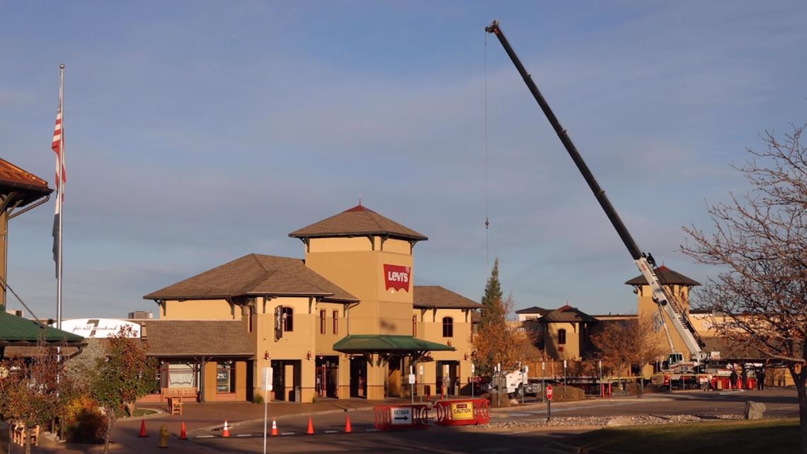 Outlets at Castle Rock trims 55-foot white fir Christmas tree 