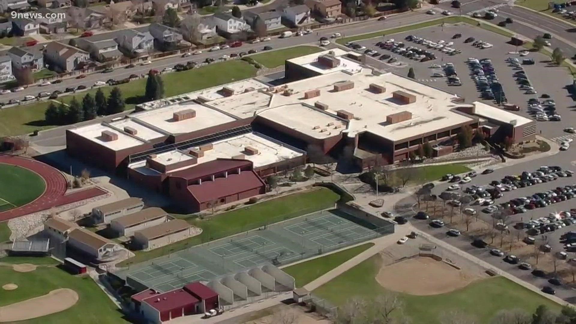 Two Rangeview High School students face criminal charges after a Snapchat photo that appeared to depict a gun on campus led to a lockdown and response from more than 70 Aurora officers.