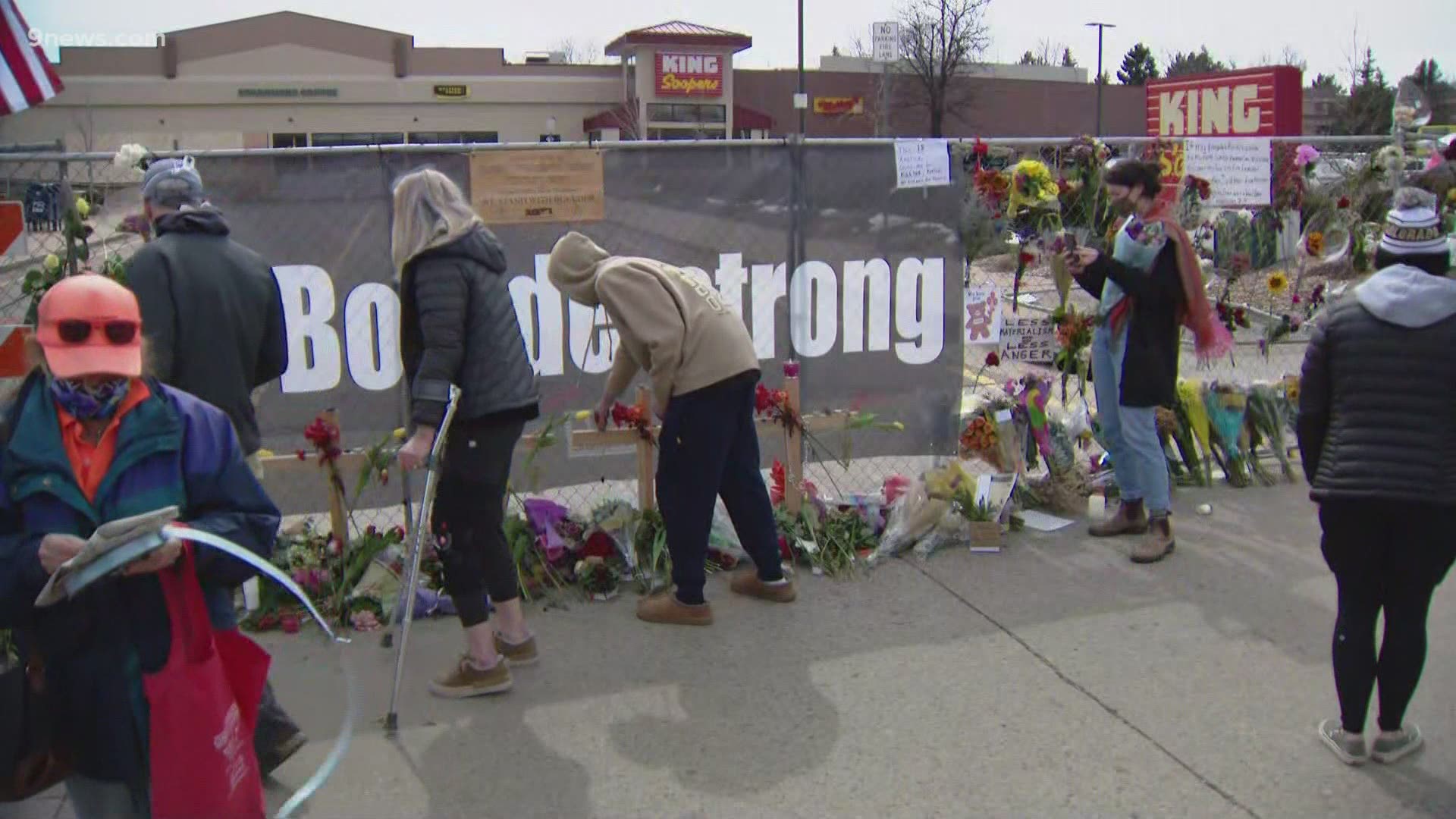 People from nearby and far away are driving by and stopping to visit the King Soopers where ten people died on Monday.