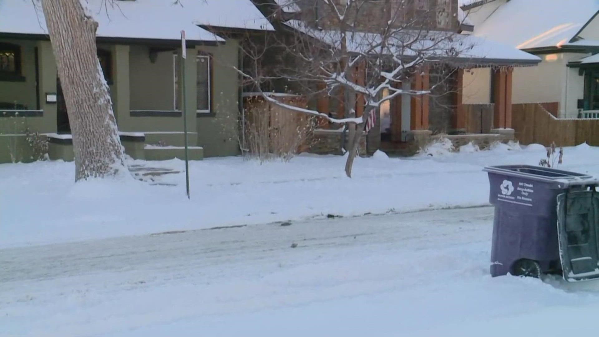 Jaleesa Irizarry takes a look at snowy and slick conditions along Denver side streets on Thursday morning.