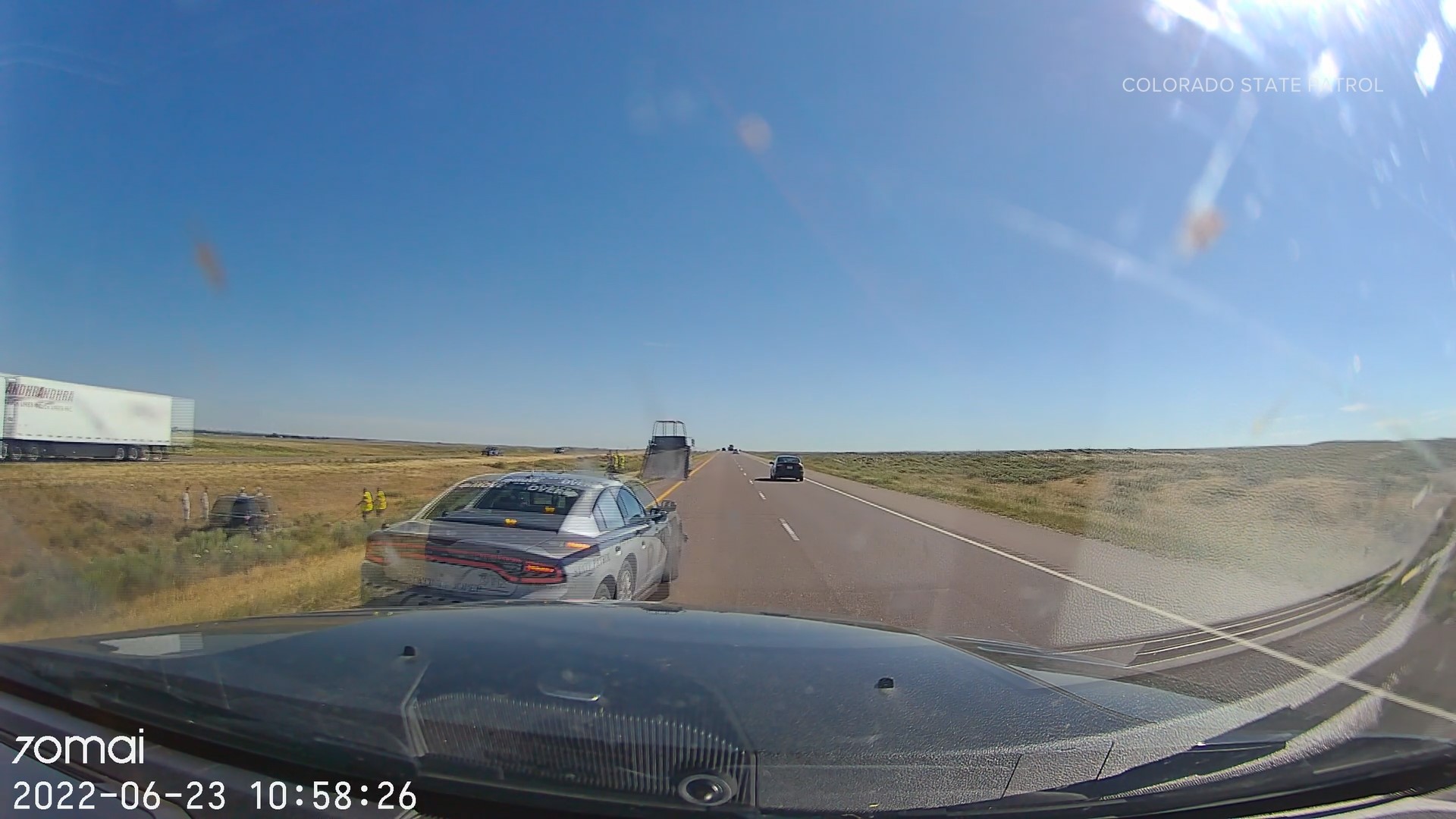 The trooper was helping a driver who was stranded on the side of the highway when CSP said a possible-distracted driver slammed into his empty patrol car.