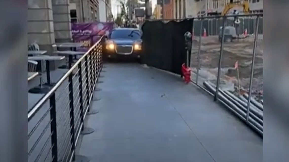 Driver squeezes car through sidewalk before hit-and-run - Vimarsana News