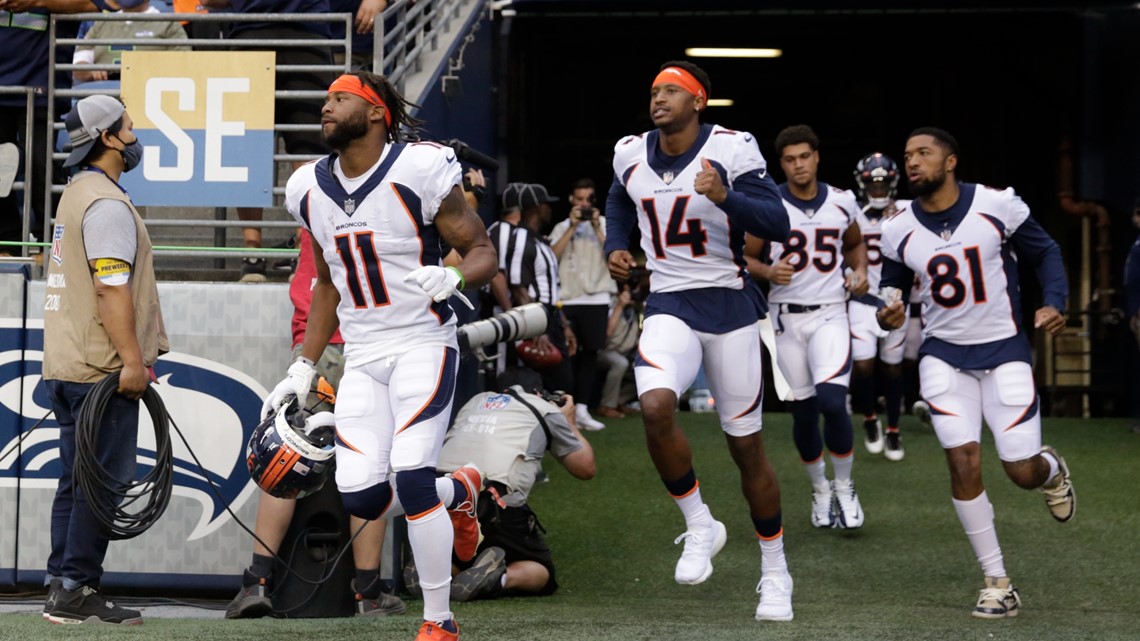 Denver Broncos' Shaun Beyer smiles while on the bench against the