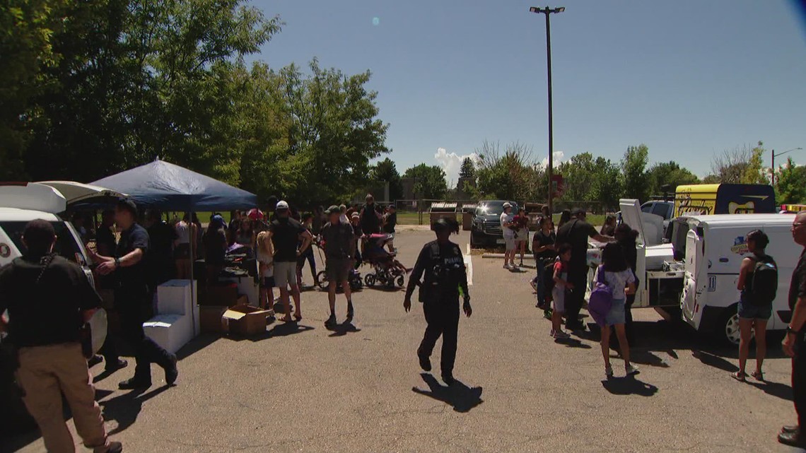 Denver organizations join police to give out backpacks and school supplies to people in need