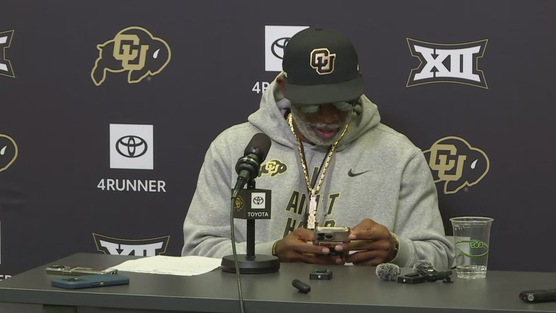 Colorado head football coach Deion Sanders checked his phone's weather app when told there was a chance of rain showers during Saturday's Baylor Bears game.