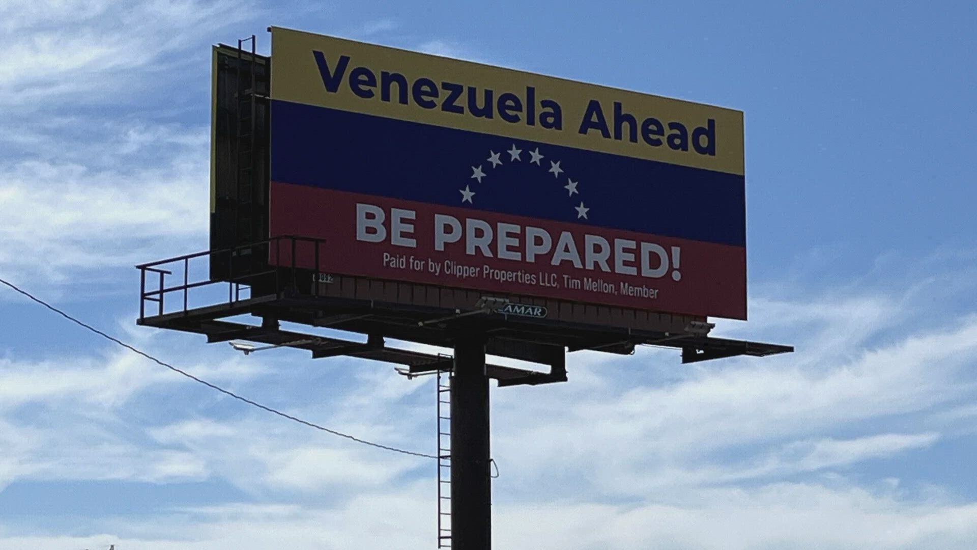 The sign referencing fears about migrants bears the name of a billionaire megadonor for Donald Trump.