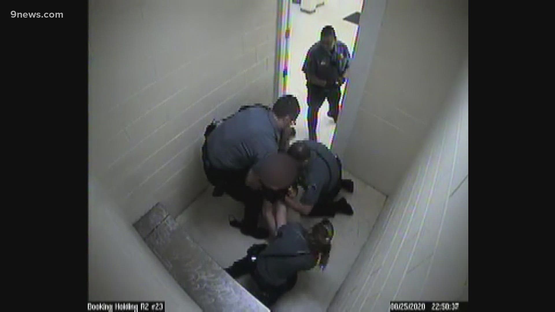 An Adams County deputy was found not guilty of assault on handcuffed inmate. After, the DA threw out failure to intervene charges against two other deputies.