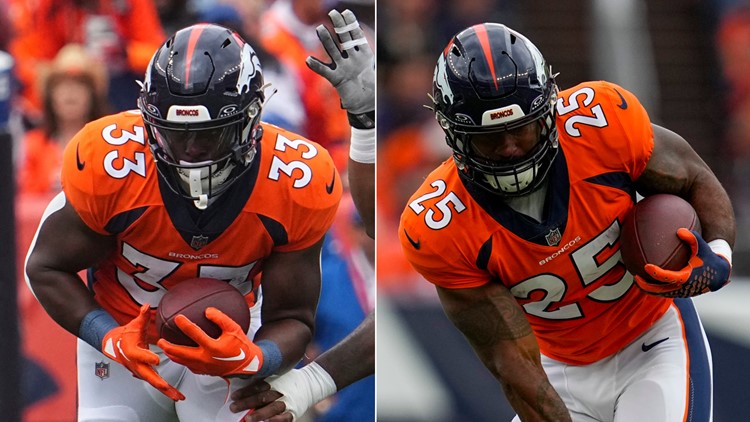 Javonte Williams of the Denver Broncos fights for yardage during