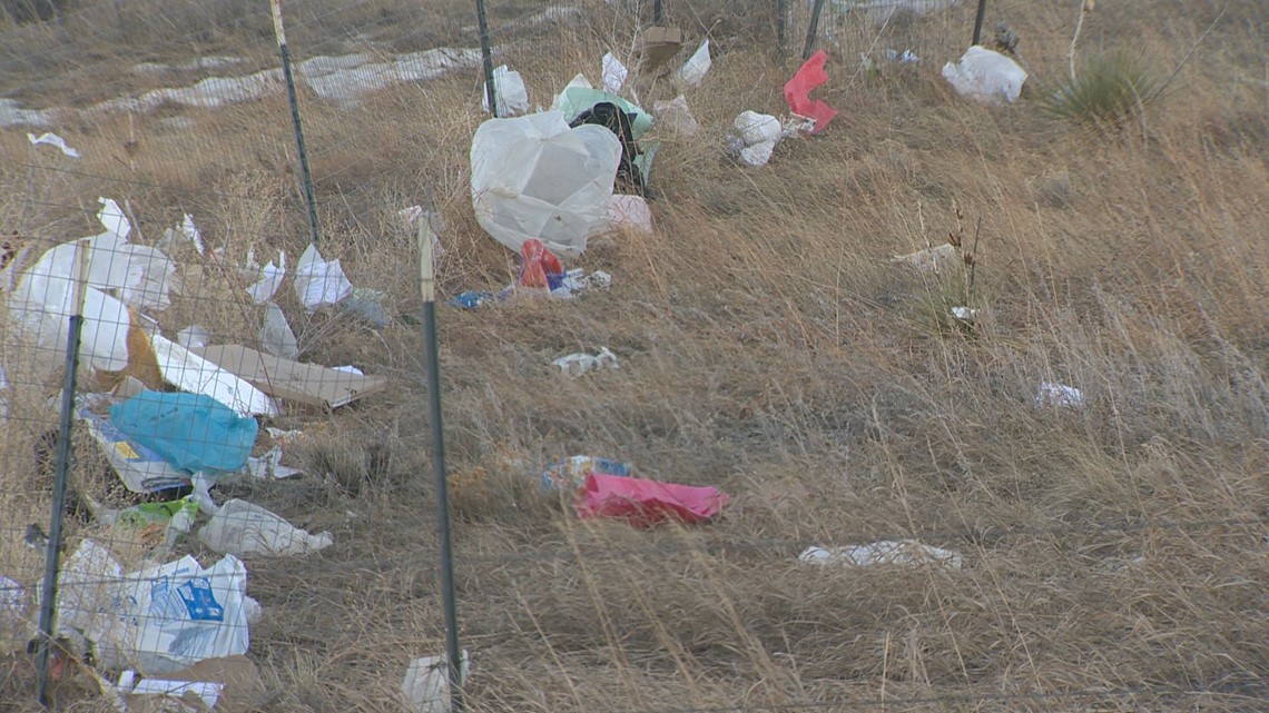 PHOTOS Residents believe trash from a nearby landfill is blowing into