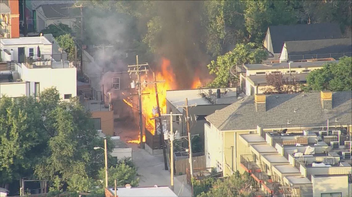 Crews battle large garage fire in Denver | 9news.com