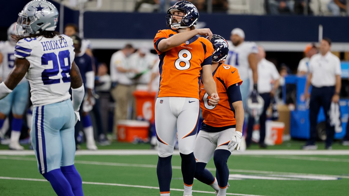 Dallas Cowboys' and Denver Broncos' kickers and other special-teams  players warm up prior to a National Football League game at the Cowboys'  home field AT&T Stadium in Arlington, Texas