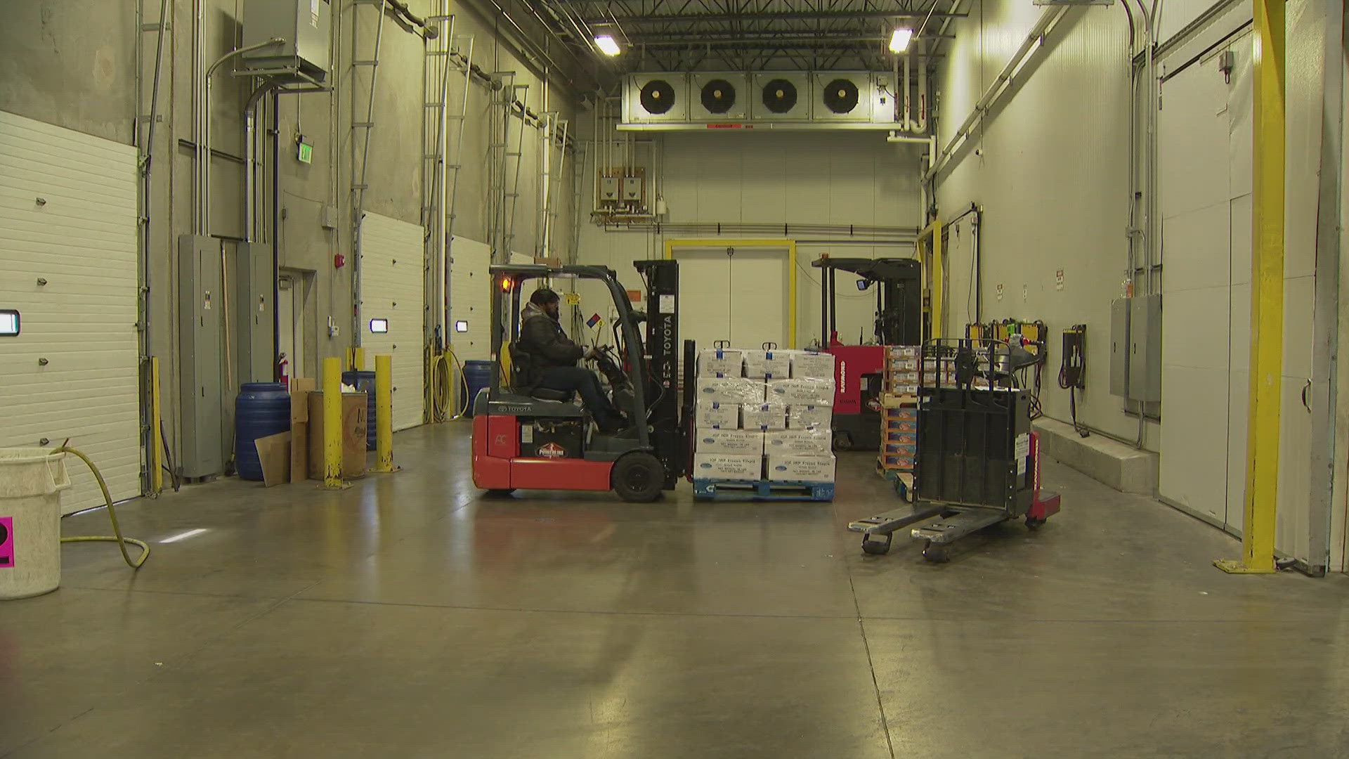 The employees at Stillman Wholesale Meats in North Denver are playing it cool at the loading dock which stays at 45 degrees during this recent heat wave.