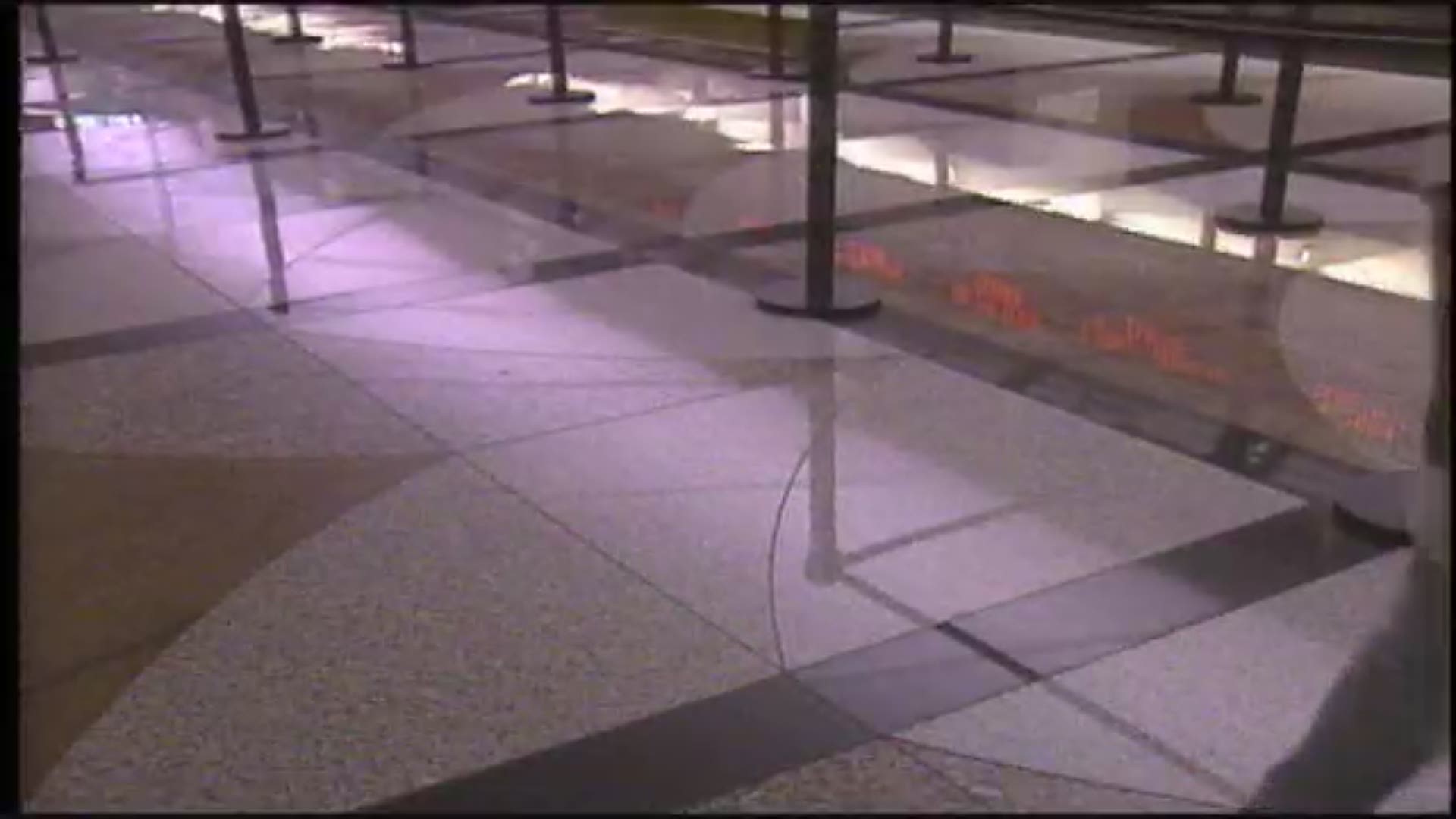 A lady on rollerblades meanders through the ticket area at Denver International Airport in this undated file video.