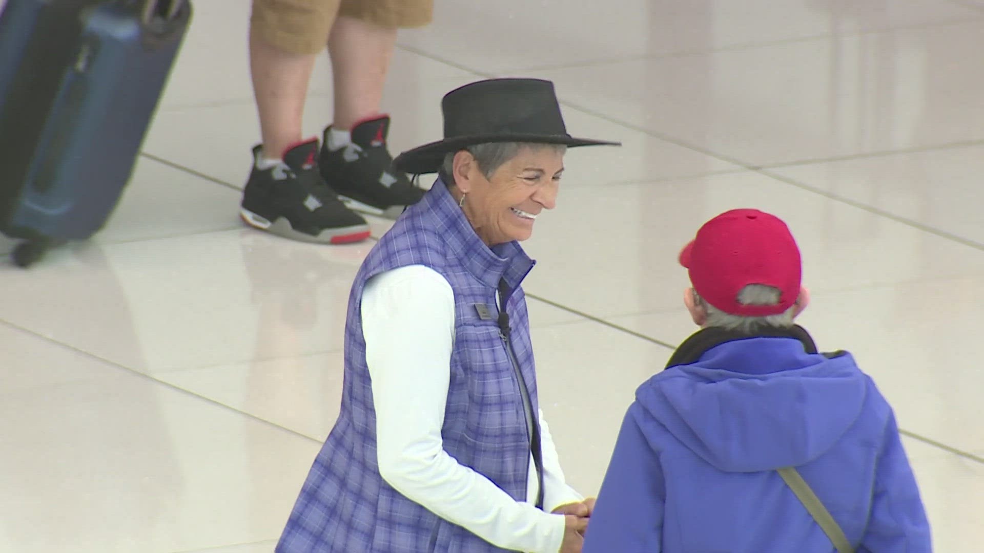 Cheryl Heinzerling is Denver International Airport's longest-serving volunteer. She's been helping travelers navigate around the airport for 28 years.