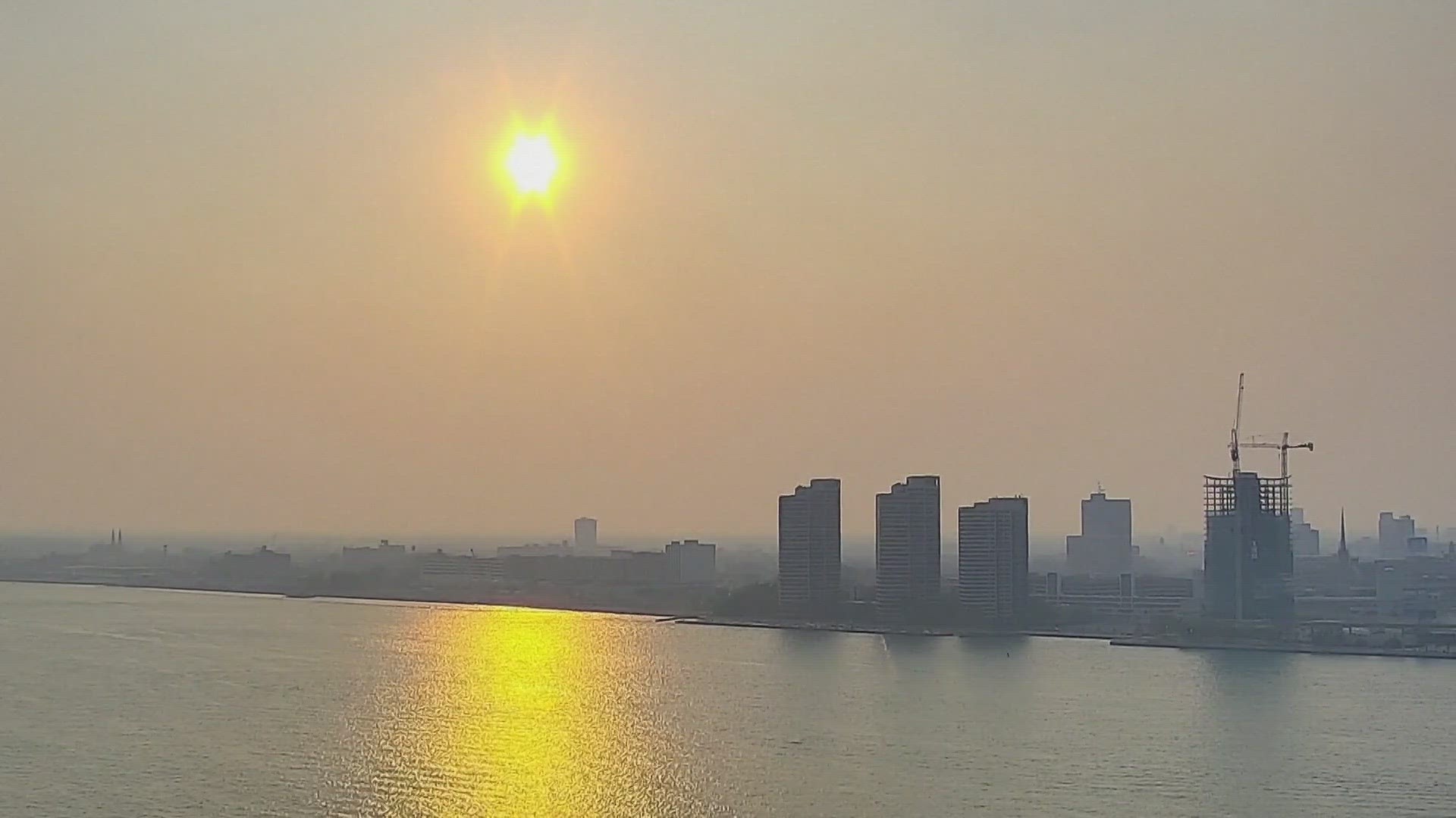 Smoke from Canadian wildfires poured into the U.S. East Coast and Midwest on Wednesday, prompting warnings for vulnerable populations to stay inside.