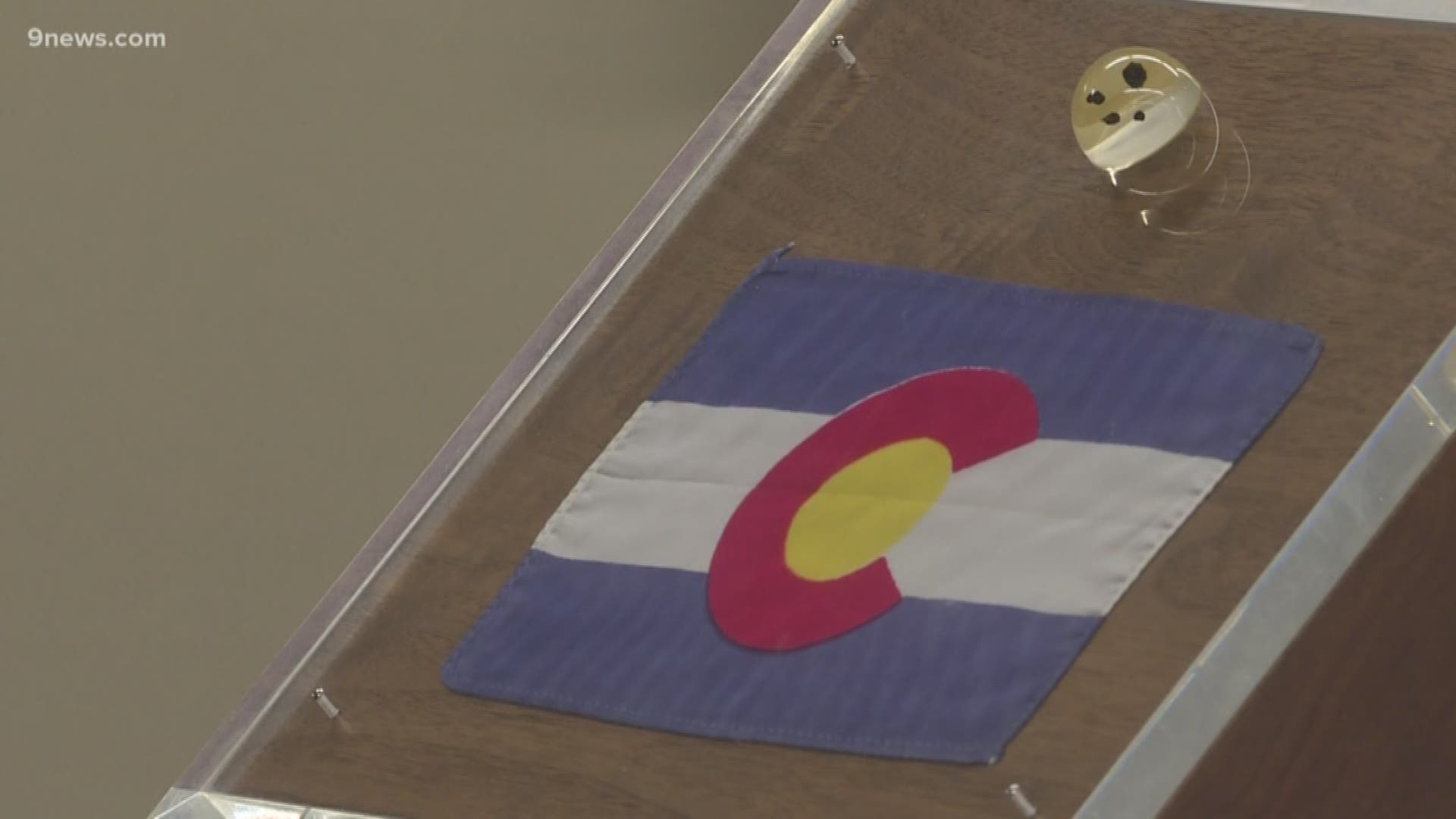 The Colorado flag that Neil Armstrong took to the moon on the Apollo 11 mission is now back in the state and out on display.