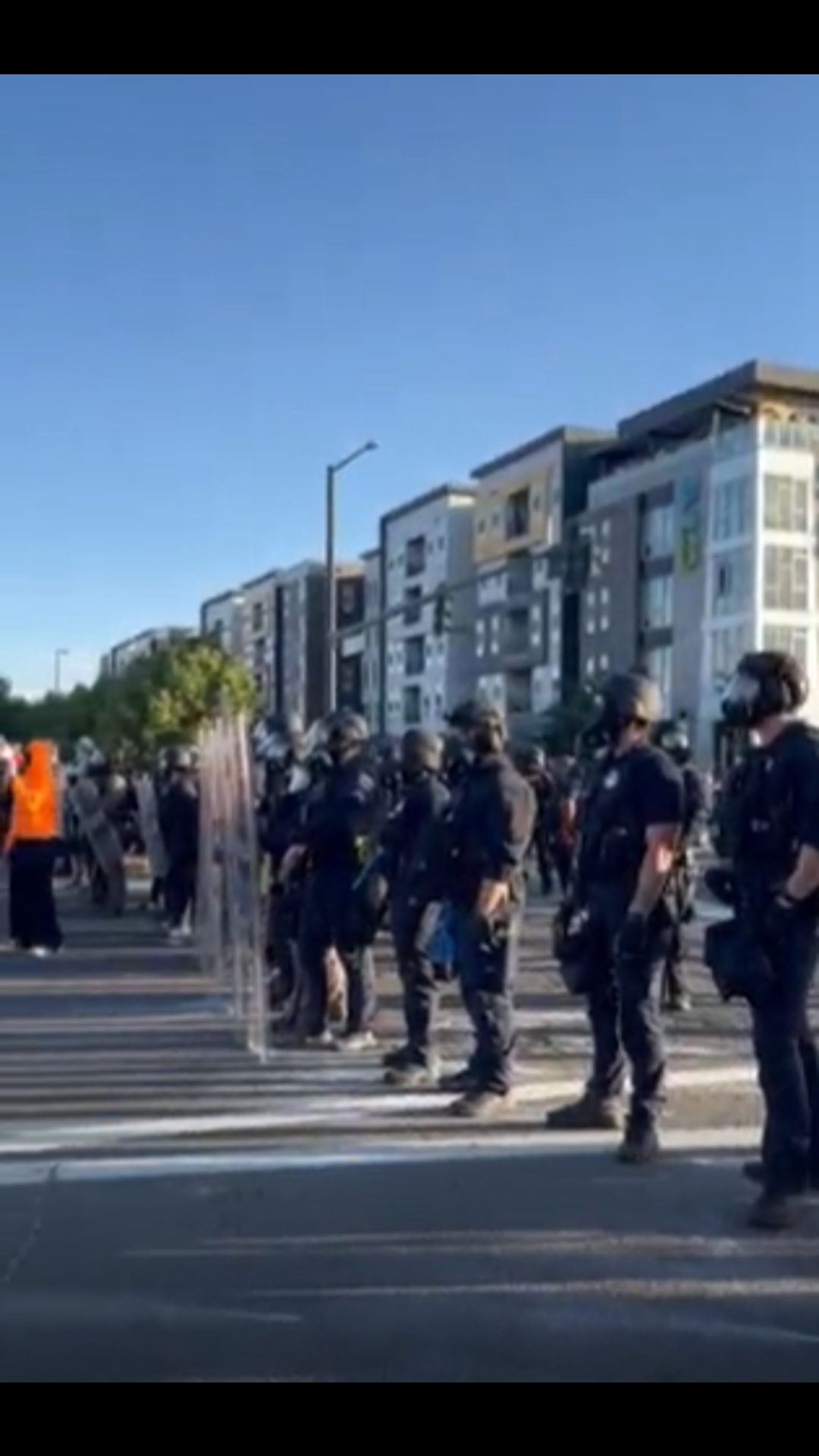 Protesters clashed with police on Colfax Avenue near Interstate 25 Saturday.