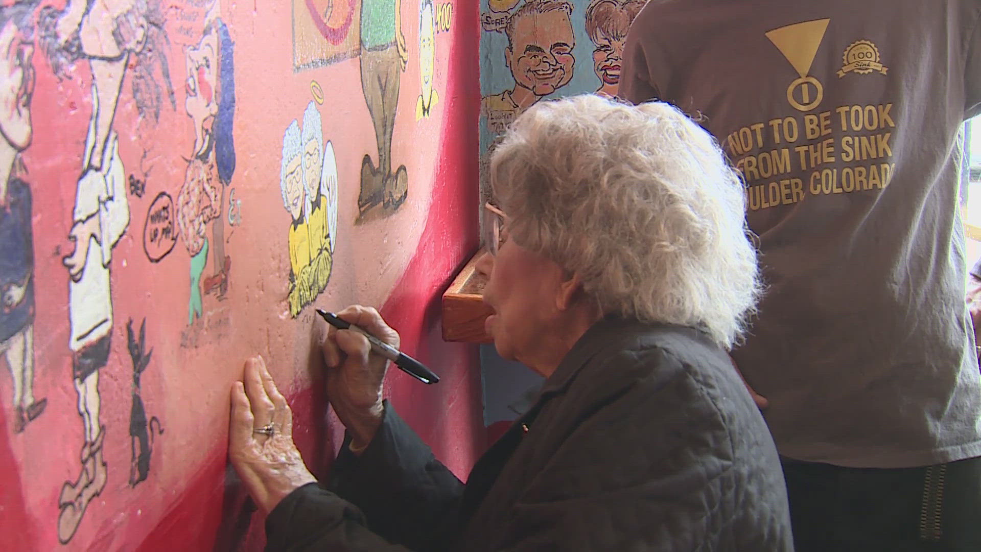 A painting of Peggy and her twin sister, Betty, was unveiled on the wall at The Sink in Boulder.