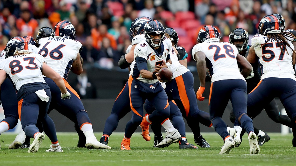 Denver Broncos orange-blue stripe uniform combo returns vs Titans