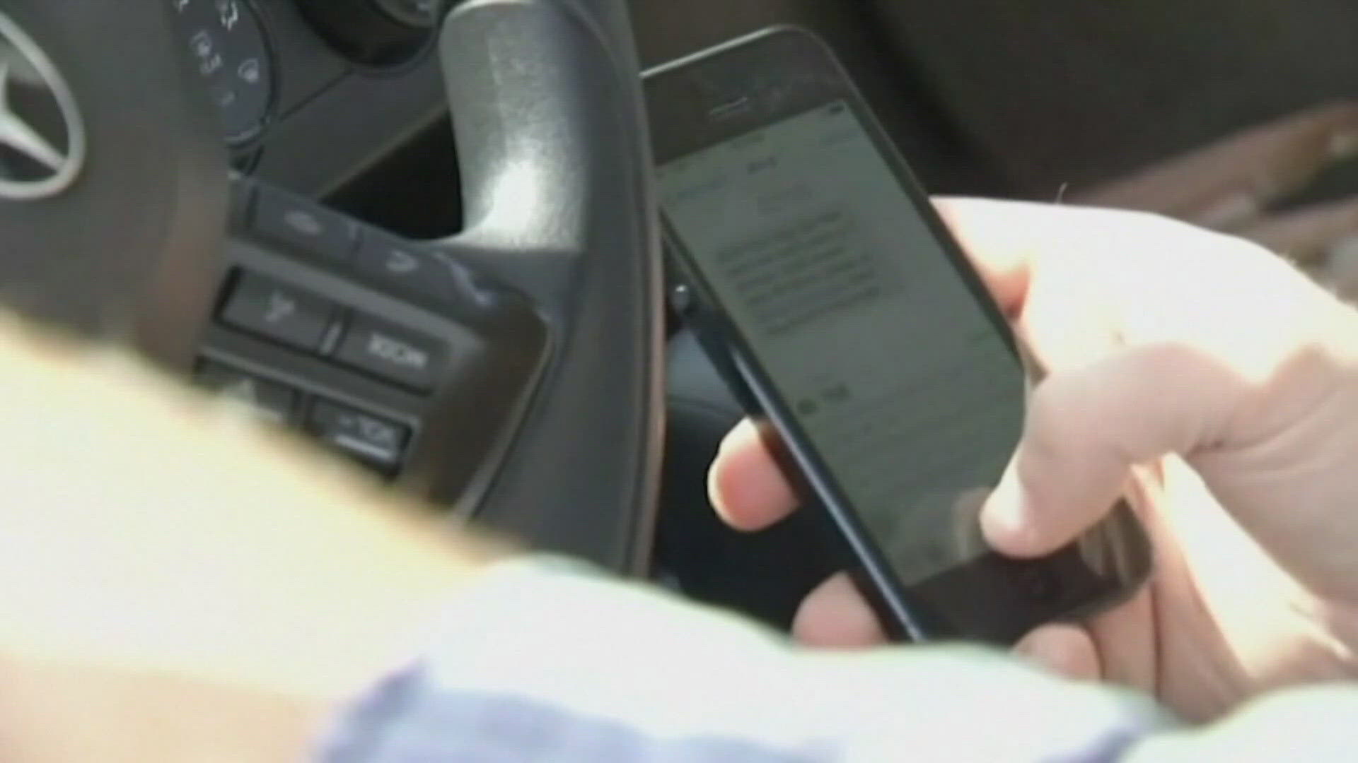 In January, a new Colorado law will go into effect that could punish you for holding your cell phone while driving.