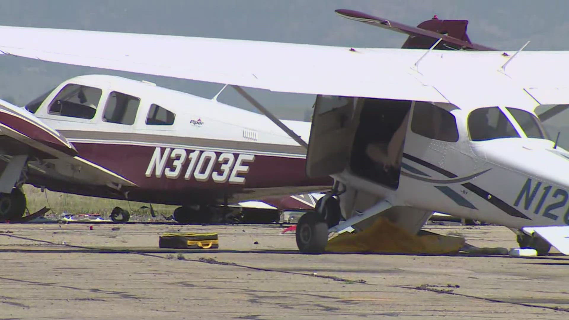 A pickup truck driver smashed through a metal fence Monday at Rocky Mountain Metropolitan Airport and hit two unoccupied planes.