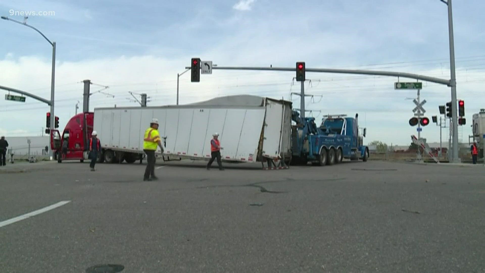 Some roads are reopening after a semi and A Line train collided in Aurora Monday.