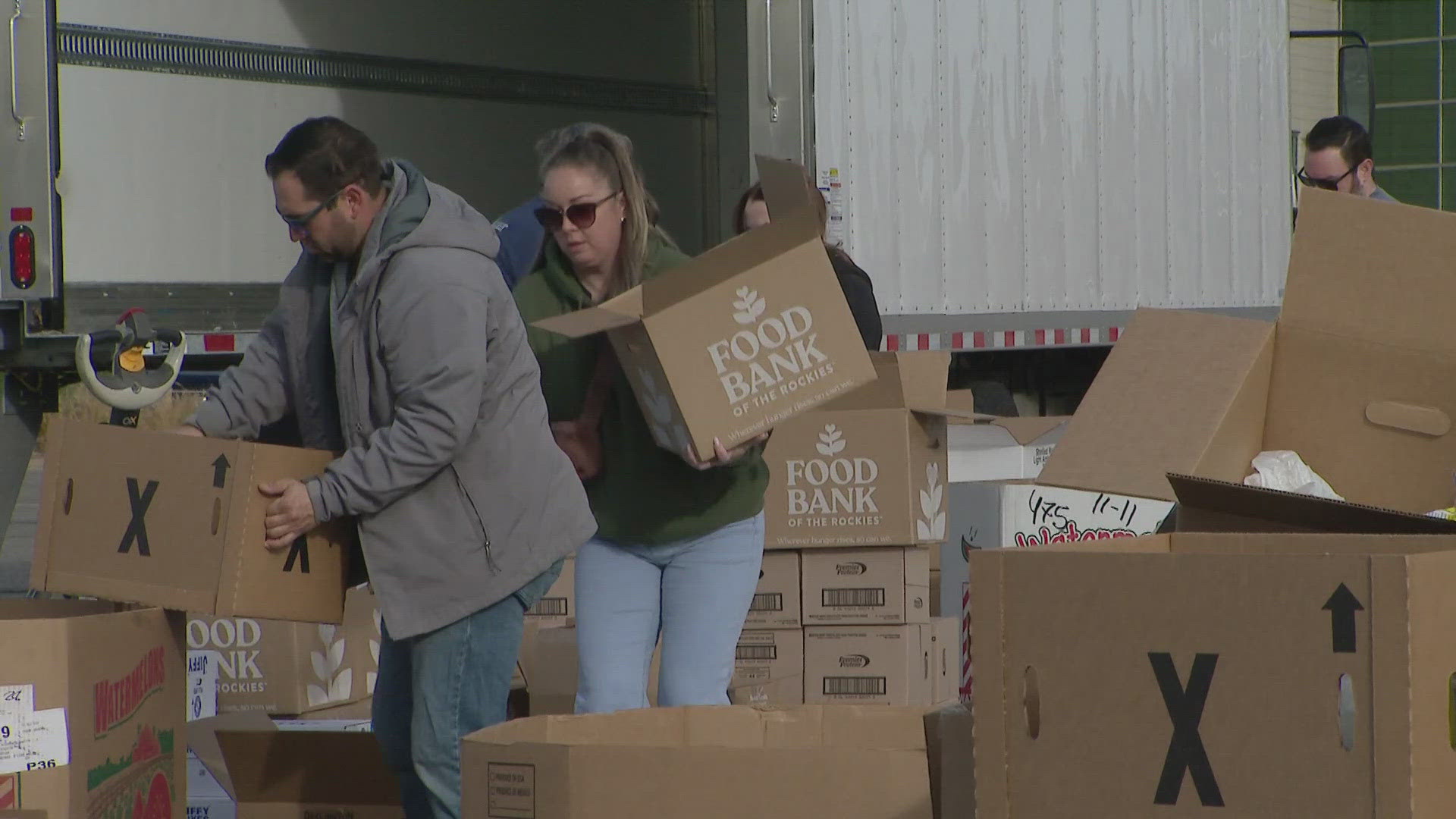 Volunteers started packing food early Friday morning to hand out meals to people in need.