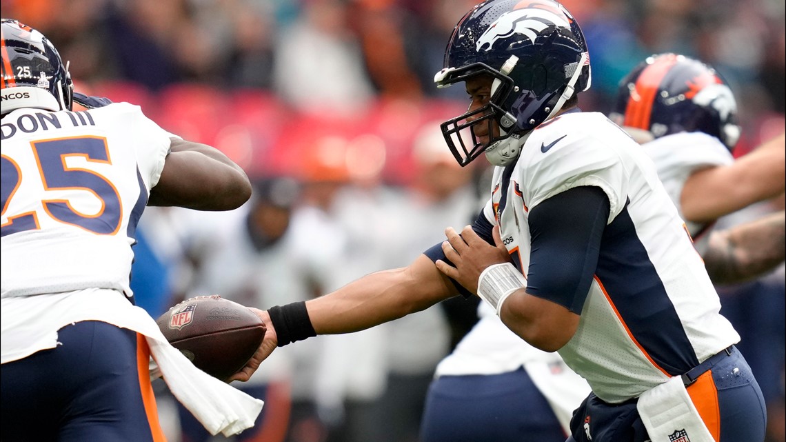 Denver Broncos orange-blue stripe uniform combo returns vs Titans