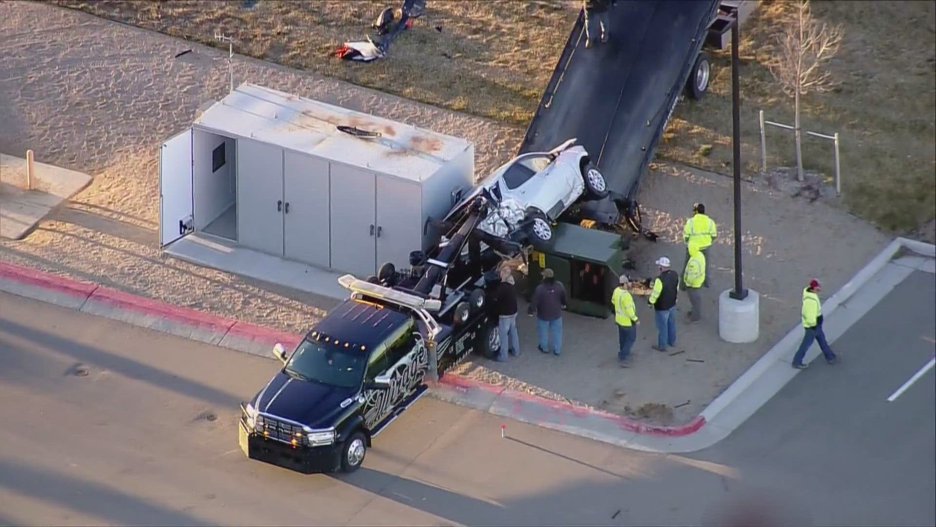A speeding car veered off Interstate 76, rolled and crashed into a transformer box. Police in Brighton, Colorado, are investigating the double fatal crash Thursday.