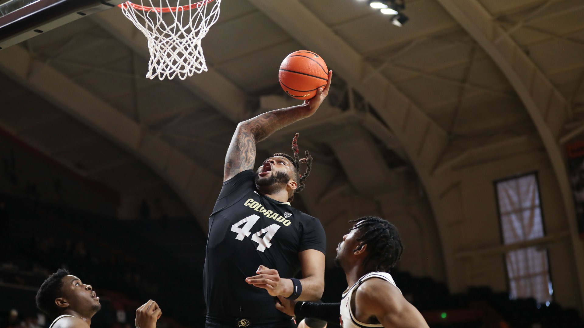 The Buffs big man honors his brother's memory with the way he plays, especially at the Big Dance.