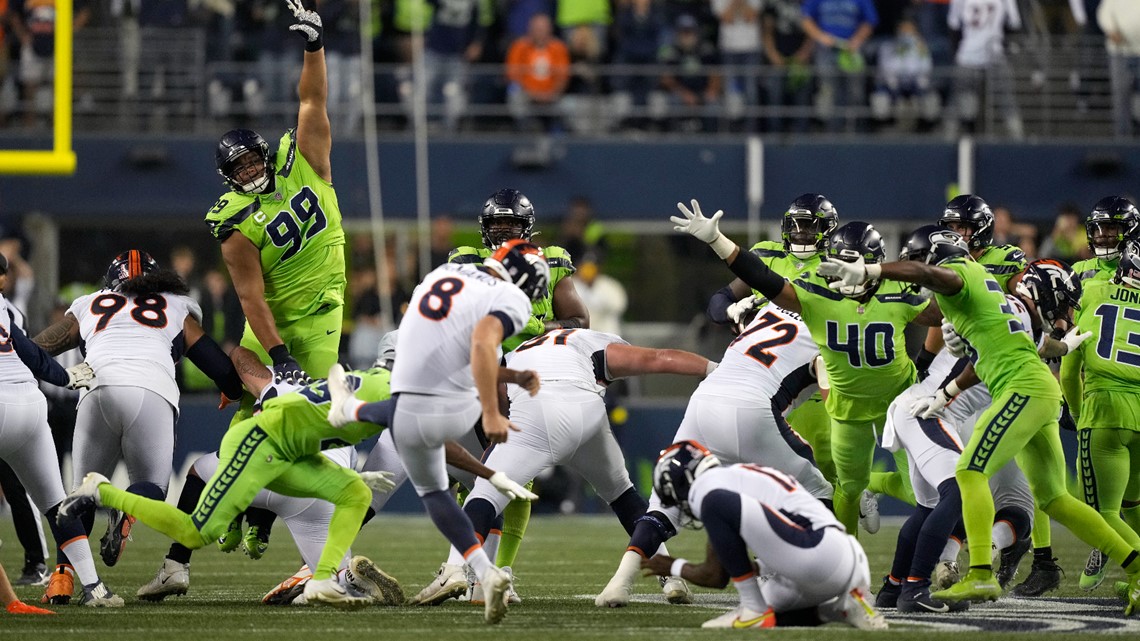 Broncos Russell Wilson greets some Seahawks, 1st fans in boo