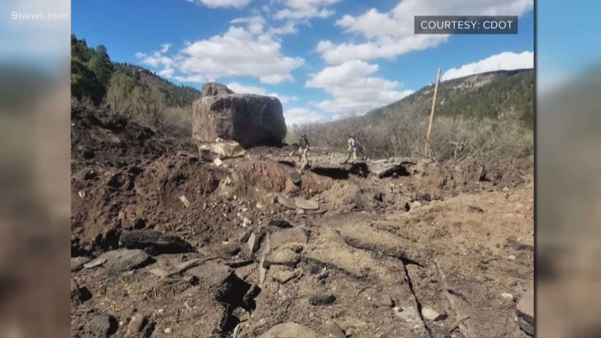 A boulder "the size of a building" is still on the road and will need to be blasted into smaller pieces before it can be removed.