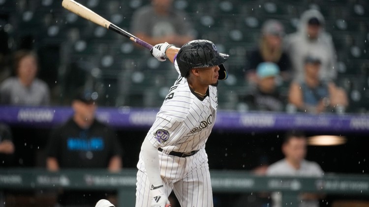 Tovar's single in storm lifts Rockies over Marlins 7-6 after blown 4-run lead