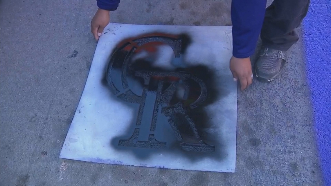 Denver celebrates Rockies home opener with a purple stripe