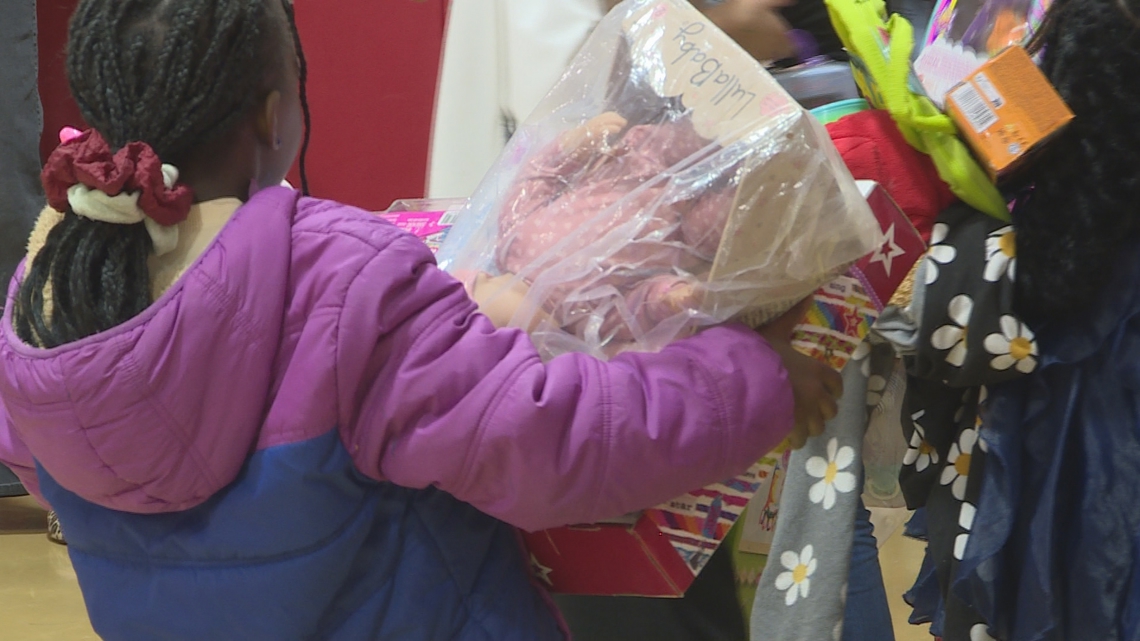 Annual Holiday Huddle connects Denver youth with professional sports teams - and toys
