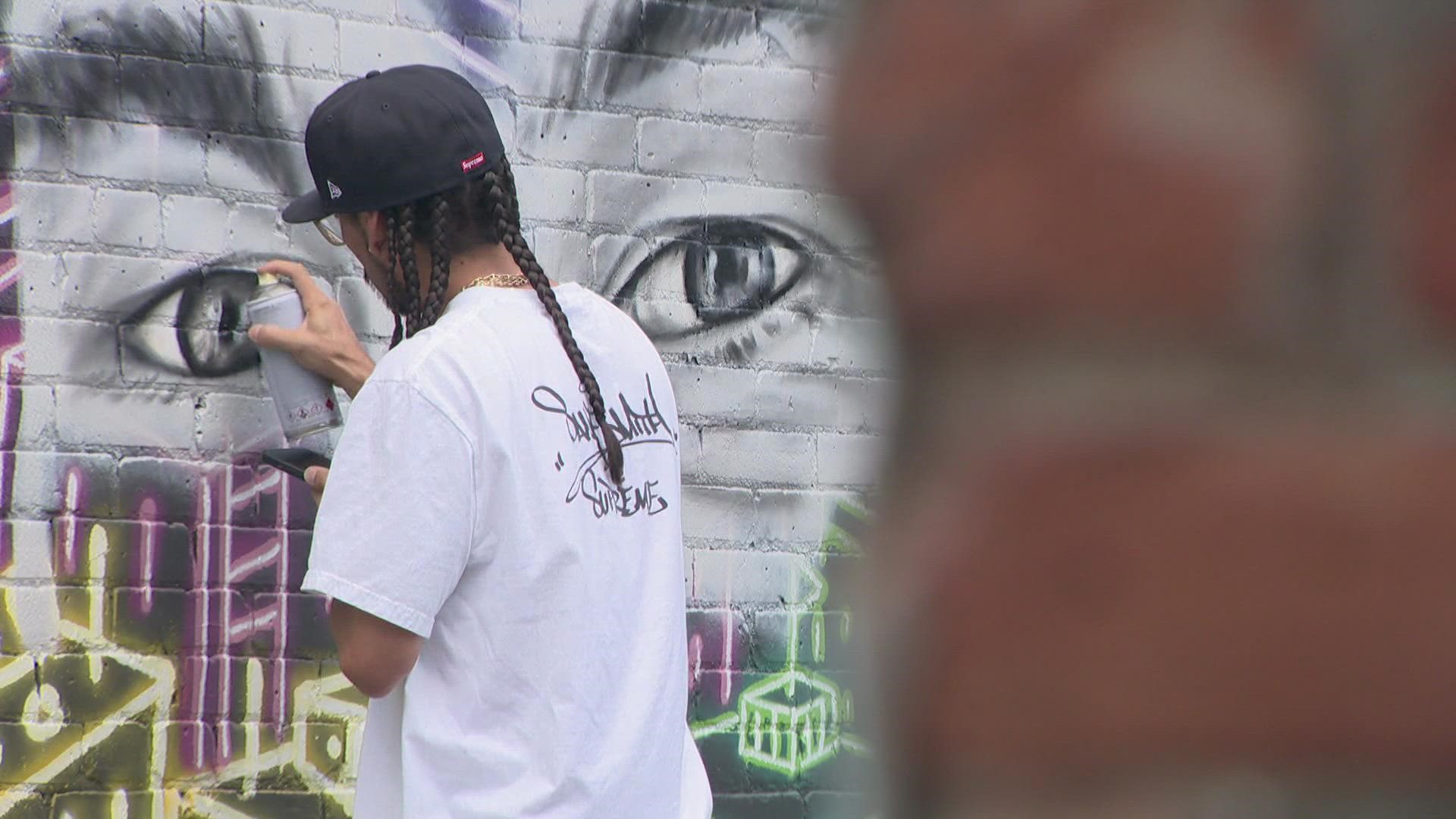 Police said Andy Billinger was shot to death last year over a gaming console. Denver street artist Chris Haven began work Wednesday on a mural to honor his friend.