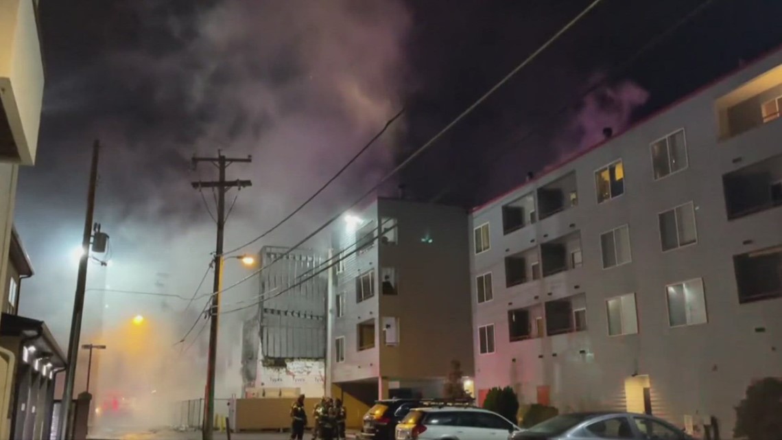 Man arrested on arson charge after fire at building under construction ...