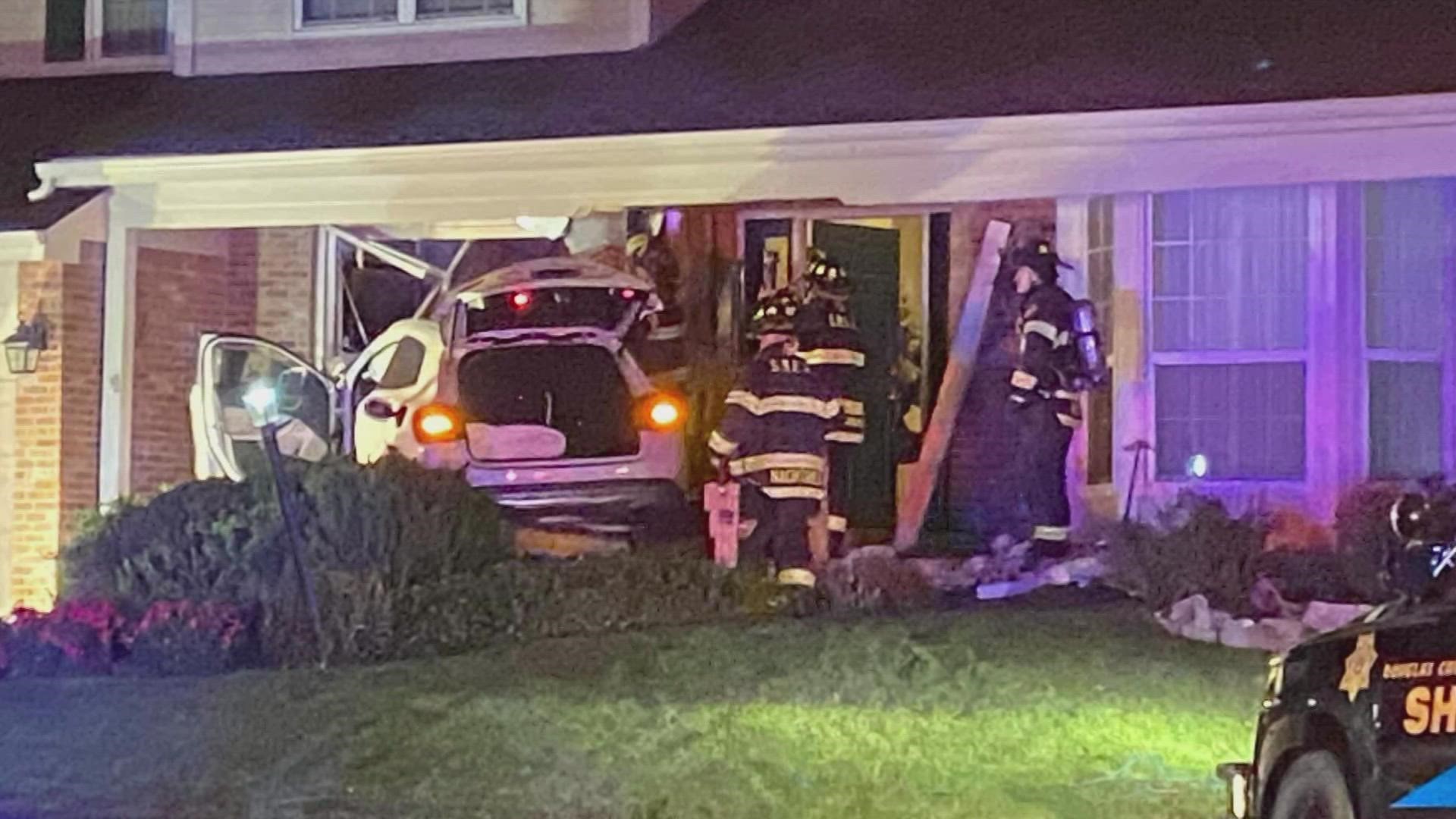 No one was seriously hurt after an SUV driven by a teenager crashed into a house Friday night following a police chase involving Douglas County deputies.