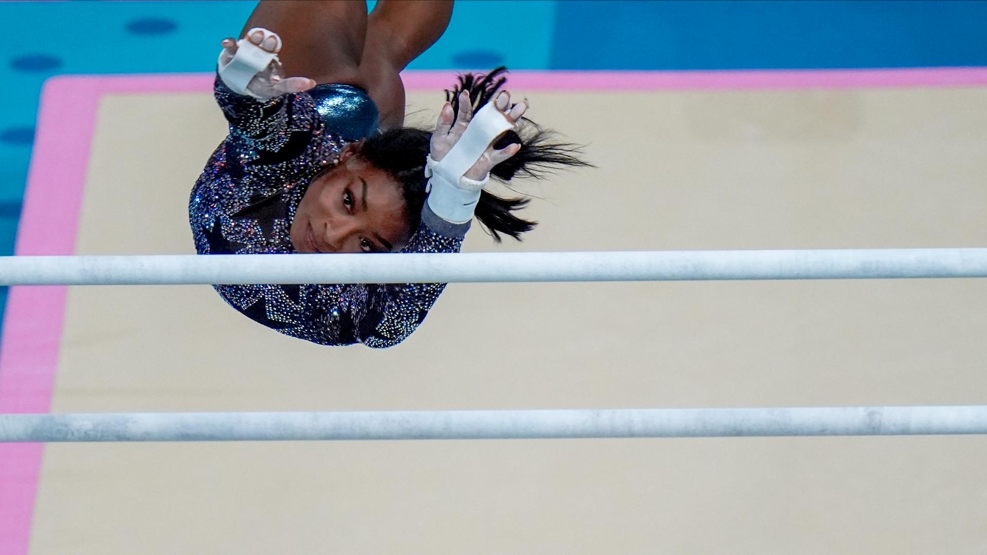 How far apart are uneven bars in Olympic women's gymnastics?