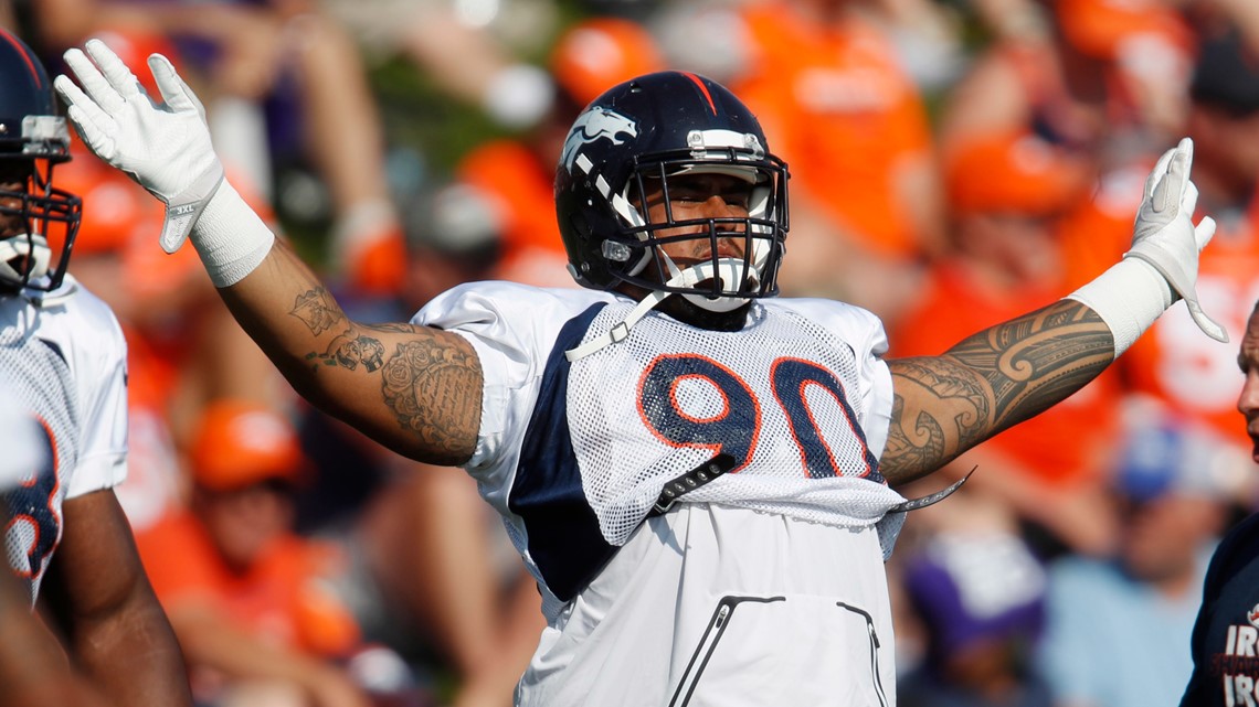 Denver Broncos nose tackle Domata Peko (94) calls for crowd